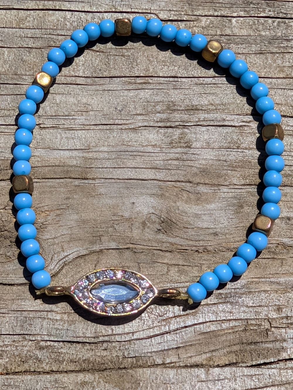 Evil Eye Blue Beaded Bracelet with Metallic Bead Accents and Crystal Center